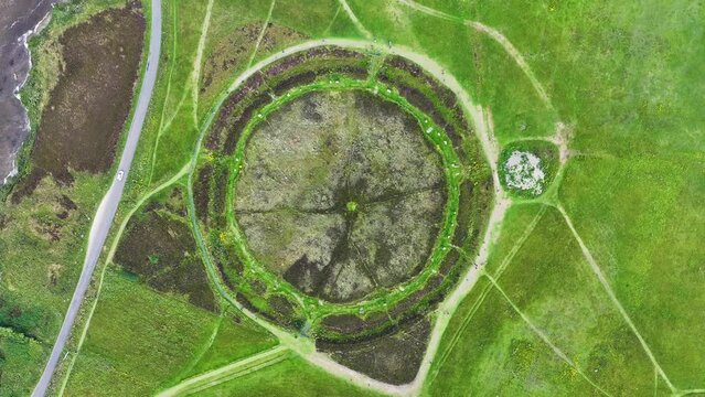 Birdseye Aerial View, Ring of Brodgar Scotland UK. Prehistoric Neolithic Landmark, Stones Arranged in Circle. High Angle Drone Shot