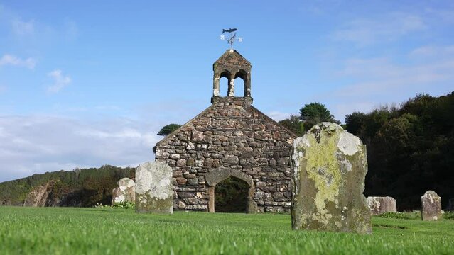 Ruins of Church of St. Brynach the Abbot, Cwm-yr-Eglwys Village, Wales UK on Sunny Day