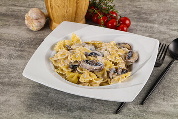 Italian cuisine - farfalle with mushrooms