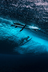 Surfer in the sea under the wave