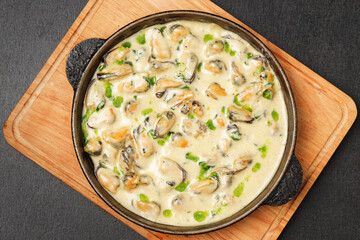 a pan of food on a cutting board