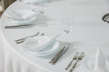 a table with plates and silverware