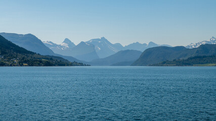 Obraz premium Crossing the wide open summer fjord