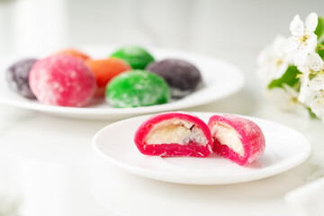 Multi-colored Japanese cakes Mochi in a white plate