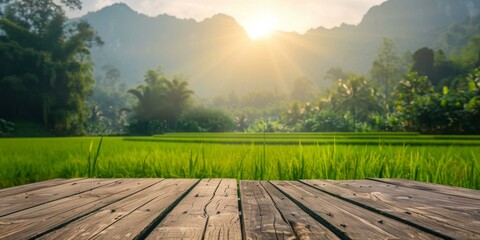An elevated wooden platform overlooks a lush green field of grass and trees in the distance with a bright sun rising in the background. AI. - Powered by Adobe