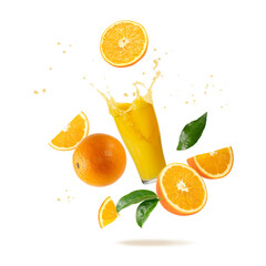 Fresh orange fruit  and glass of splashing juice with drops and leaves falling flying i