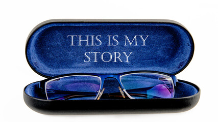 Business and my story concept. Text This is my story on an open case with eyeglasses
