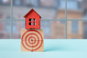 House on Target Blocks Symbolizing Real Estate Goals