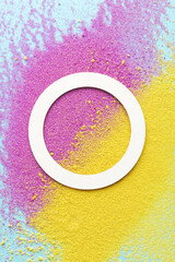 A white circle is on a yellow and pink background