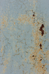 Rusty metal surface. Rough vertical background. Dirty aged pattern. Grunge cracked background. Industrial textured backdrop. Scratch template. Vintage blue and yellow corrosion banner.