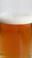  Texture of beer foam covering fresh draft beer in a glass stock photo for vertical backgrounds