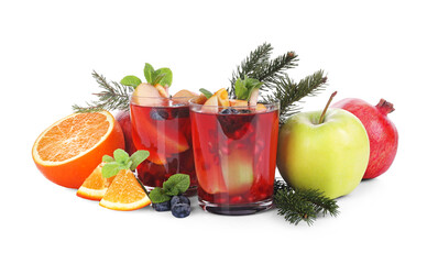 Aromatic Sangria drink in glasses, ingredients and Christmas decor on white background