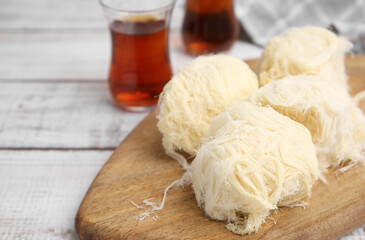 Eastern sweets. Tasty Iranian pashmak on white wooden table, closeup
