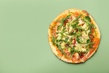 Delicious vegetarian pizza on green table, top view. Space for text