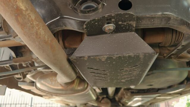 protective shield for the car 4x4 system. auto differential iron metal protection for off-road, 4k video.