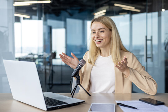 Professional woman hosting a podcast in a modern office