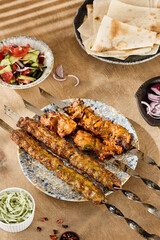 Outdoor Summer Barbecue with Friends Enjoying Kebab Skewers, Lavash Bread, and Salad on a Wooden Table