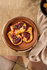 Delicious Fried Cheese with Cranberry Jam Served in Rustic Kitchen Setting