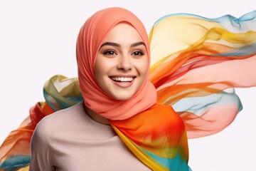 Portrait of beautiful caucasian happy smiling woman wearing colorful hijab over white png background. Waving head scarf, femininity, concept of goods for muslim islamic women. Copy space for design.