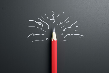 A red pencil with doodles showing a burst of creativity on a dark grey background, concept of...