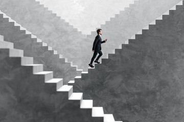 Side view happy young businessman walking on various concrete success stairs on light background. Career ladder and promotion concept.