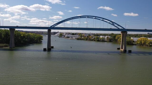 Aerial view of Green Bay Wisconsin Tower Drive Leo Frigo arched bridge; drone rising
