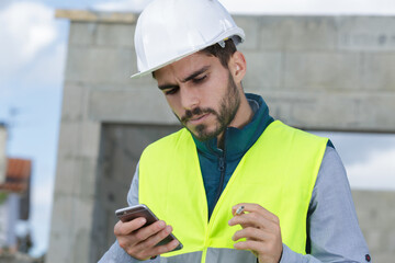 supervisor using a mobile phone while smoking