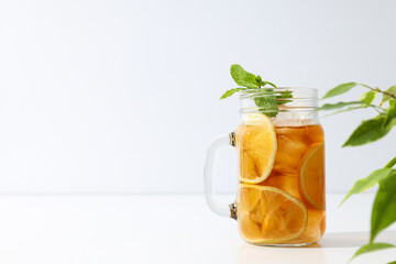 A glass of delicious cold tea on a white background