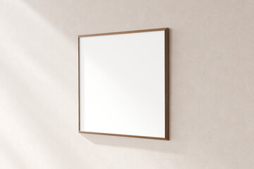 Blank square frame on a textured plain wall, casting a soft shadow, giving a minimalistic...