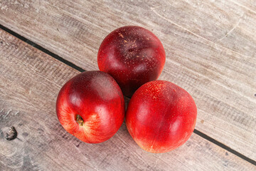 Ripe sweet juicy nectarines heap