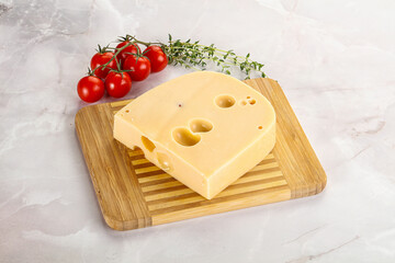 Maasdam cheese brick over board