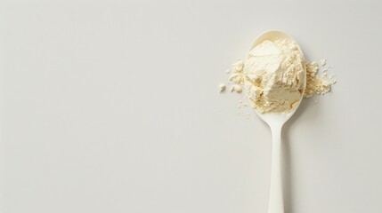 Plastic spoon filled with plant-derived keto protein powder on an isolated background. Space to copy additional text or design elements