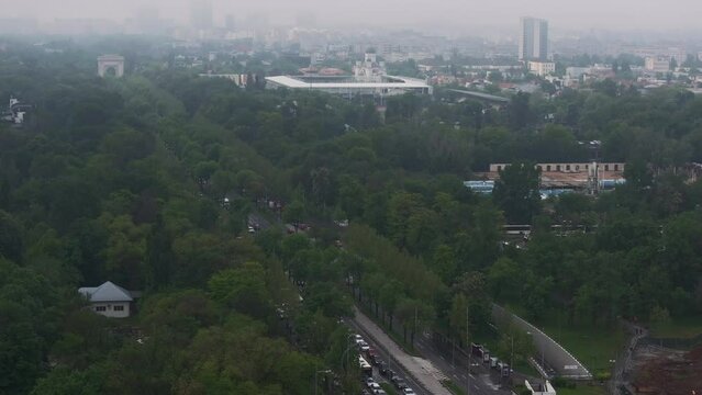 Bucharest 4K aerial video. Cloudy spring morning landscape with the north part of Bucharest, next to Arch of Triumph and Free Press Square (Piata Presei Libere in Romanian). Travel to Romania.