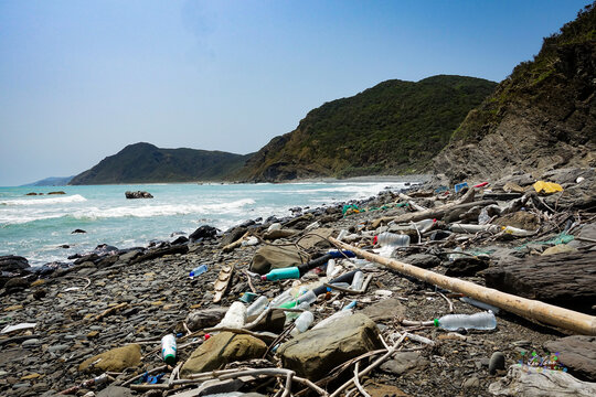 marine garbage debris driftwood Styrofoam Polystyrene foam. Plastic box on deserted shore magnificent coastline stretches behind, Environmental pollution issues