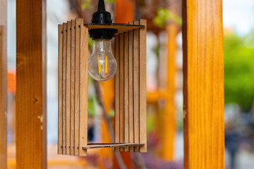 wooden lamp with a light bulb inside