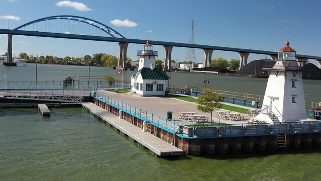 Aerial view of Green Bay Wisconsin Tower Drive Leo Frigo arched bridge with two lighthouses; drone push