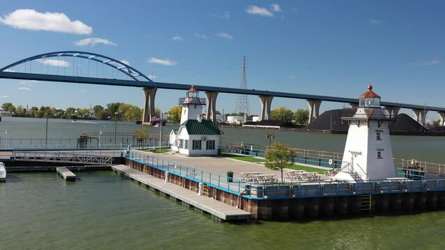 Aerial view of Green Bay Wisconsin Tower Drive Leo Frigo arched bridge with two lighthouses; subtle drone movement
