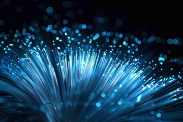 Mesmerizing Blue Fiber Optic Cables Emitting Light in a Dark Background