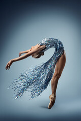 Ballerina Dance in Fantasy Silver Dress. Ballet Dancer bending Back backwards. Beautiful Girl in...