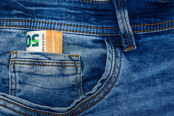 Euro bills in jeans pocket background. Euro banknotes in jeans back pocket. 1