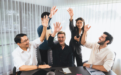 Group of diverse office worker join hand together in office room symbolize business synergy and...