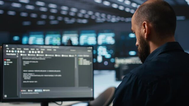 IT supervisor overseeing server room, running code on PC, troubleshooting rigs. Software admin upgrading hardware clusters, networking systems and storage arrays, close up shot