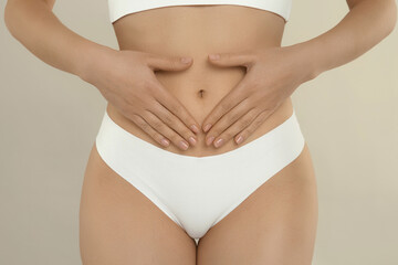 Gynecology. Woman in underwear on light background, closeup
