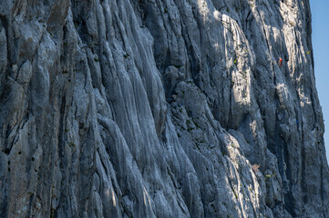 Silhouette of a climber on a steep rock. Mount Anica Kuk, Paklenica National Park, Croatia.