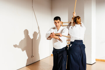 Martial Artists Practicing Wooden Swords Techniques
