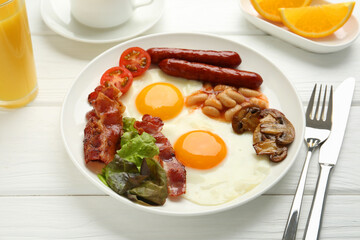 Delicious breakfast with sunny side up eggs served on white wooden table, closeup