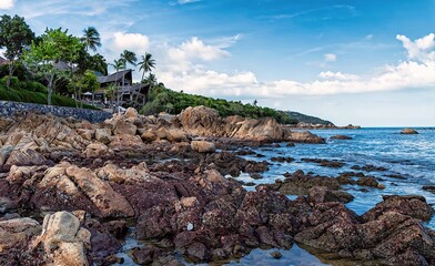 Scenic dramatic landscape of the Koh Samui Island coastline, with rocks and stones on the shore....