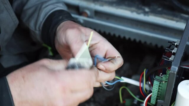 Electrician prepares the installation of electrical wiring. Electrician prepares cables for installation