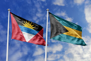  3d illustration. Antigua and Barbuda and The Bahamas Flag waving in sky. High detailed waving flag. 3D render. Waving in sky. Flags fluttered in the cloudy sky.