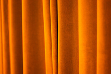 Warm golden velvet curtains abstract background
